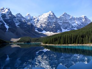 Turquoise Moraine Lake below snow-capped peaks in Banff National Park
