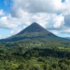 The cone of Arenal Volcano above rainforest and hot springs