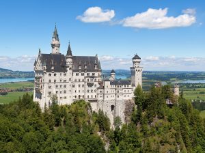 Neuschwanstein Castle above the Bavarian forest in autumn